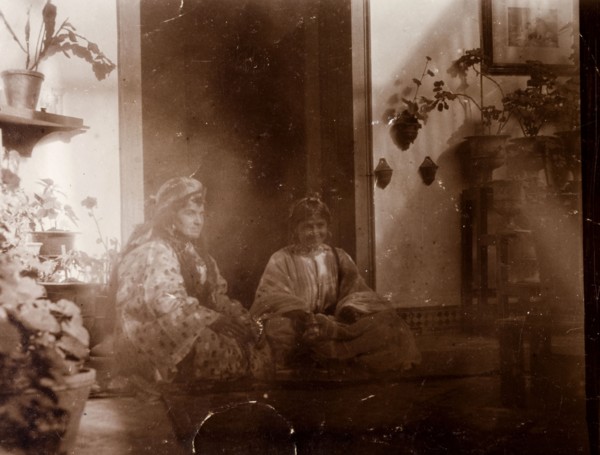 Mrs Russi dressed as a 'moorish woman'. Mrs Russi, a European woman, sits in the doorway of a