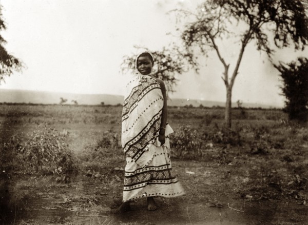 Kavirondo girl. Portrait of a young Kenyan girl dressed in a patterned wraparound robe that covers