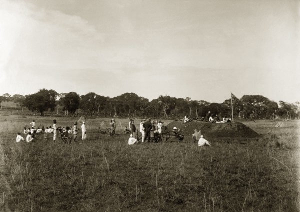 Firing point annual meeting. A group of European men accompanied by their African servants, take
