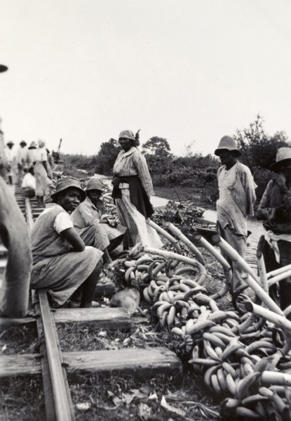 Banana sellers, Uganda. Banana sellers hope to attract passing trade beside a railway track and
