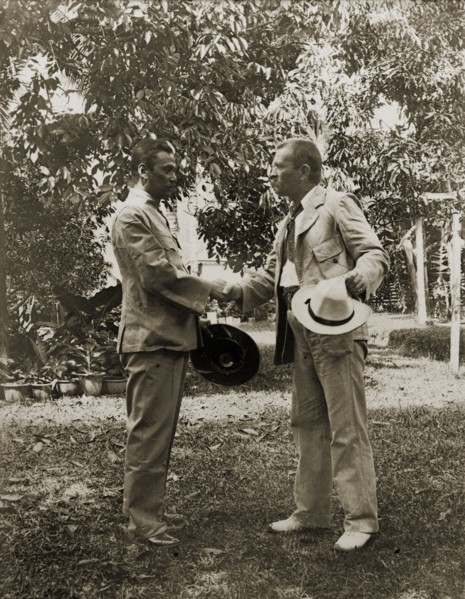 Directors of Anglo-Siamese Boundary Demarcation shake hands. Phya Suntara, Siamese Commissioner,