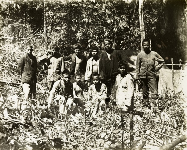 Malay assistant surveyors and porters. Malay assistant surveyors and porters from a British-led