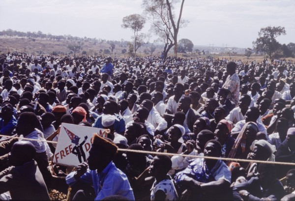 Crowd at United National Independence Party rally. A crowd of Zambian supporters sit and watch a