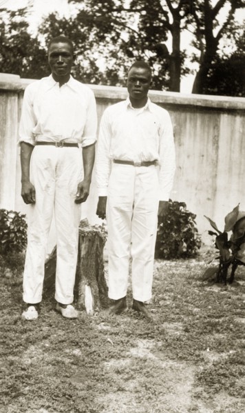 Domestic servants in a garden. Portrait of two male domestic servants, 'Joe' a cook and 'Sam' a