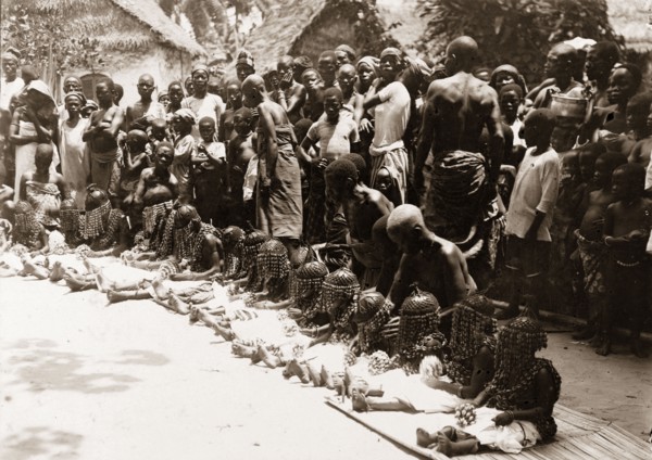 Children's festival, Nigeria. A line of young children wait to perform a traditional dance at a