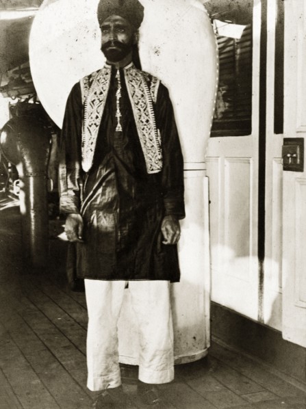 A workshop labourer all dressed up. A workshop labourer dressed in his finest clothes aboard a