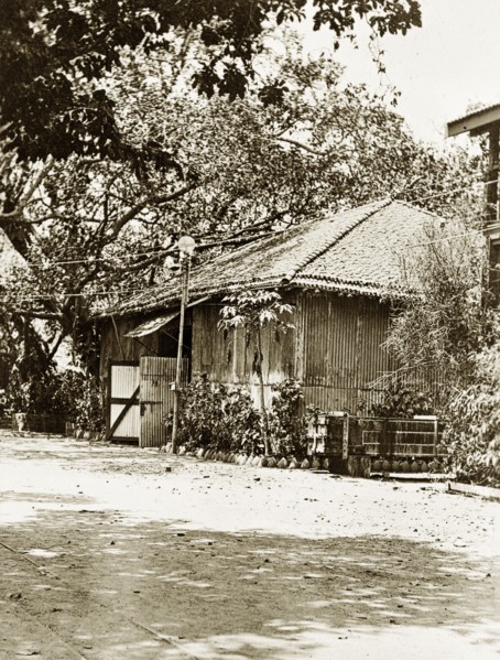 Road to the Bombay dockyard. A road leading to the slipways and boat sheds of a government dockyard