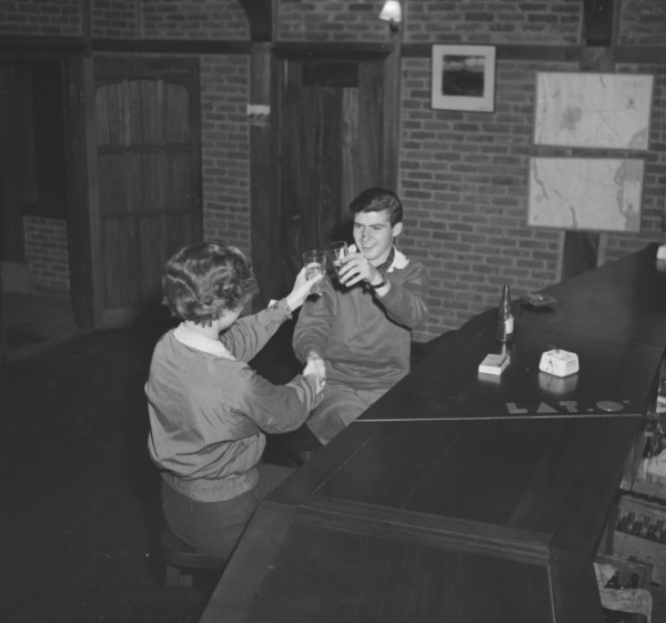 Jean and John raise a toast. A couple identified as 'Jean and John' raise their glasses in a toast