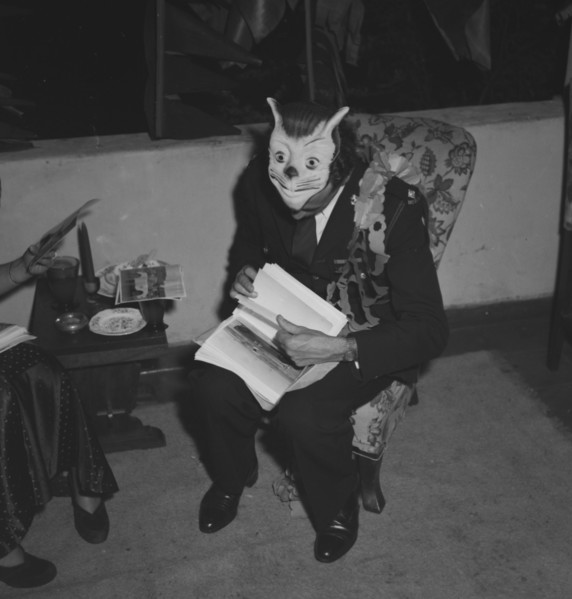 Ron Richardson with mask. Ron Richardson takes a break from the merriment at the Archer's New