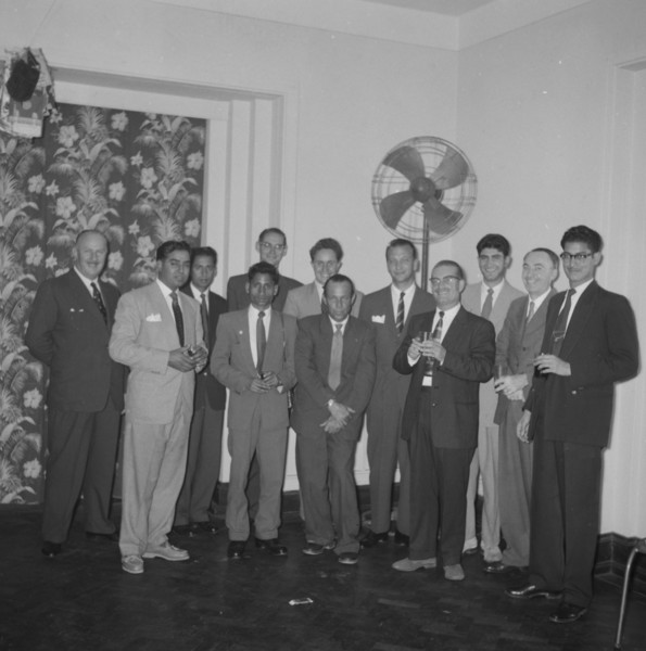Kodak cocktail party. Mixed race staff employed by Kodak pose for a group portrait at a company