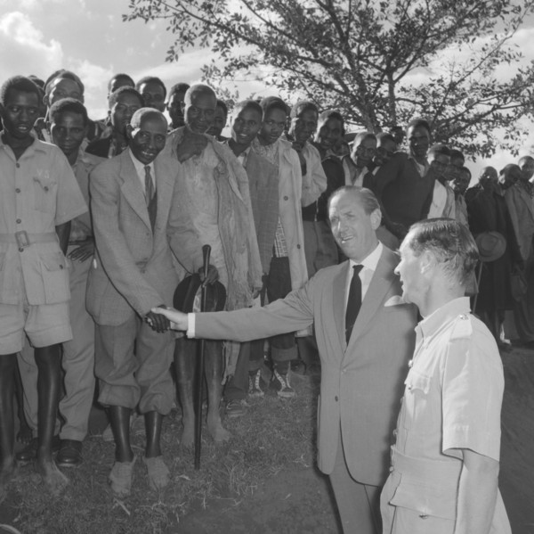 Lennox-Boyd visits Fort Hall. Publicity shot of Alan Tindal Lennox-Boyd (1904-1983) shaking the