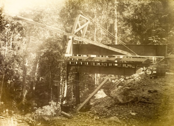 Railway viaduct under construction. Construction equipment in place at the site of a partially