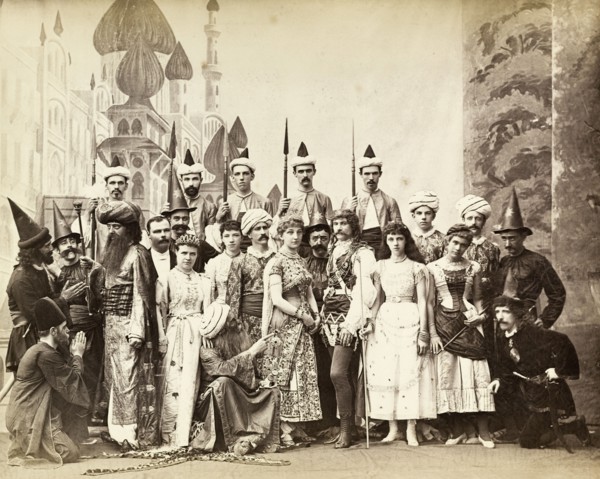 Cast of Lalla Rookh. The European cast in a pantomime of Lalla Rookh. The group stand on stage in