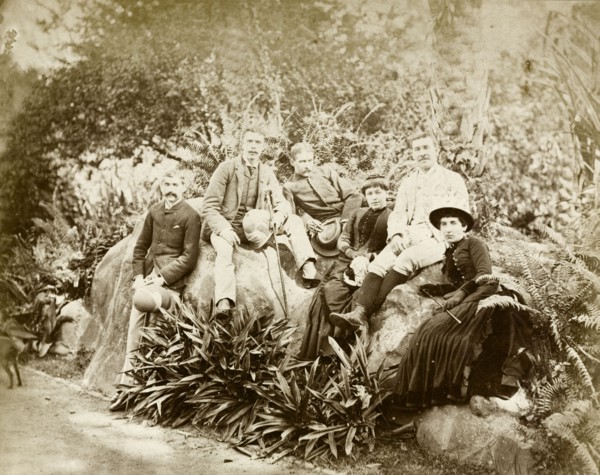 Relaxing in Eden Gardens. Informal group portrait of four European men and two women relaxing in