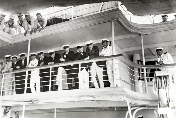 On board entertainment. King George V (r.1910-36) is entertained by a pillow fight aboard HMS