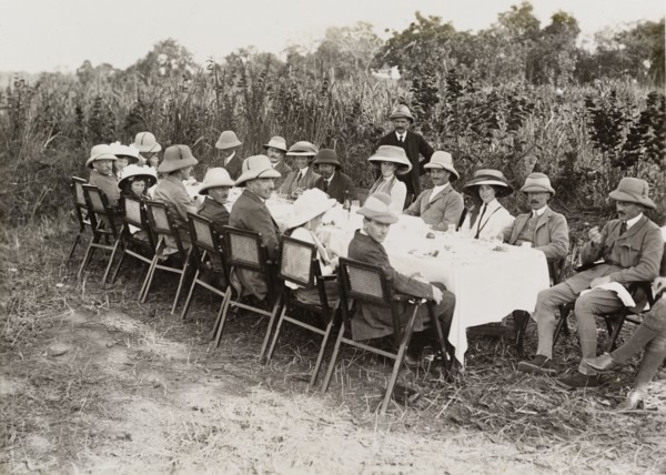 Royal lunch in the jungle. King George V (r.1910-36), seated fourth from left on the far side of