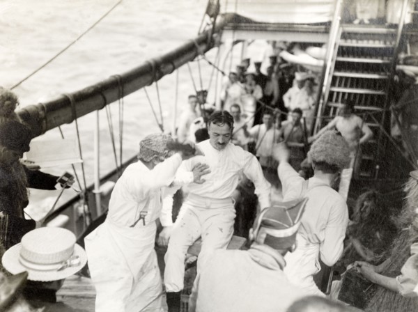 Antics aboard the S.S. Balmoral Castle. Crew members aboard the S.S. Balmoral Castle clown about on