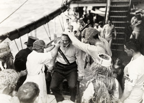 Antics aboard the S.S. Balmoral Castle. Crew members aboard the S.S. Balmoral Castle clown about on