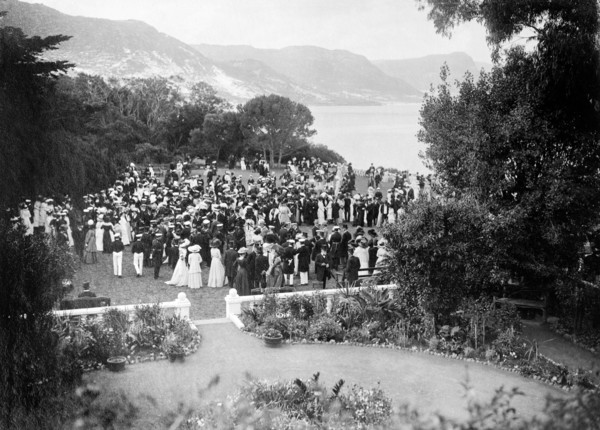 Garden party for the Duke of Connaught. Formally dressed guests socialise at a garden party held in