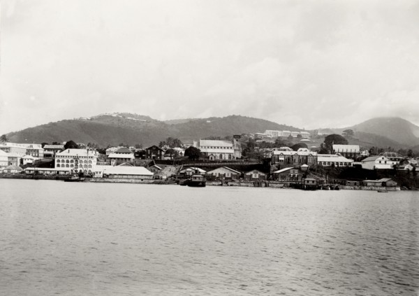 Coastal town in southern Africa. View of an unidentified coastal town surrounded by mountains. The