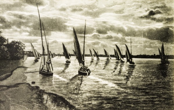 Sunset on the Nile. Sailboats at sunset, floating calmly on the waters of the River Nile. Egypt,