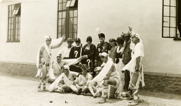 Soldiers in fancy dress. A group of British soldiers pose, wearing a variety of fancy dress