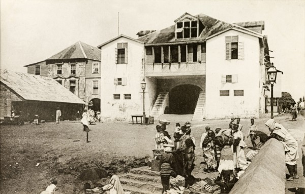 Freetown police station. Women sell textiles outside Freetown police station and law courts.