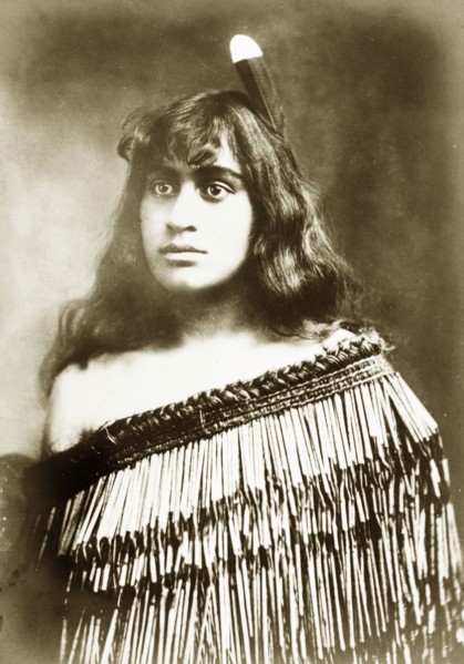 Young Maori woman. Studio portrait of a young Maori woman whose traditional dress has been made