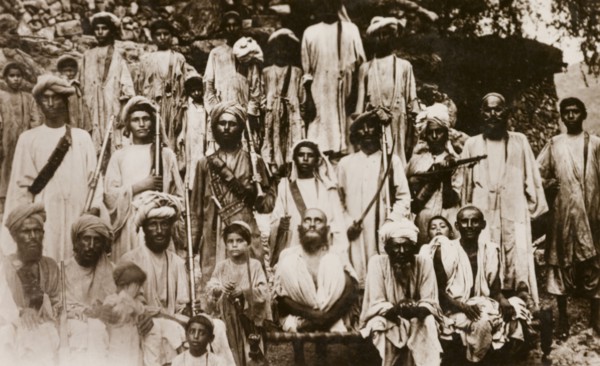 Islamic Mullah with followers. Group portrait of an Islamic Mullah with his religious followers,