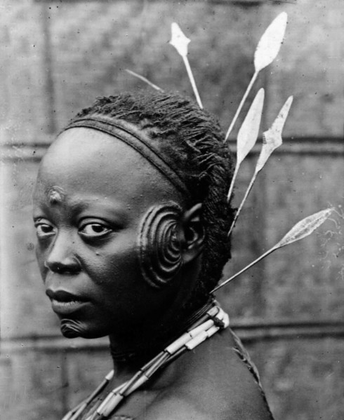 Oyster' cicatrisation. Portrait of a Congolese woman, her face scarred with a prominent 'oyster'