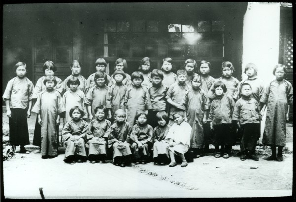 Children freed from 'mui tsai'. Portrait of a group of child slaves, freed from domestic servitude