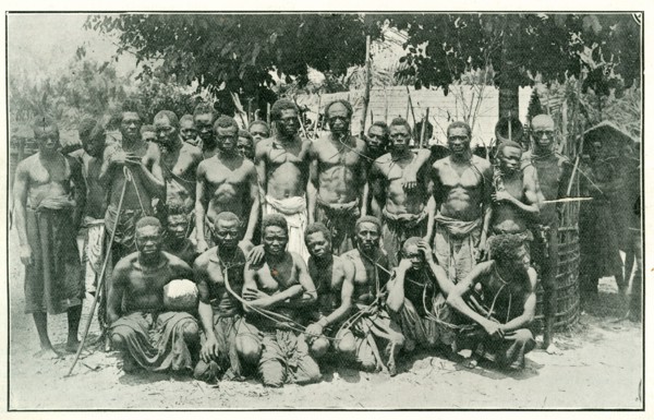 Congolese rubber slaves. Portrait of a group of male slaves, tied together with ropes around their