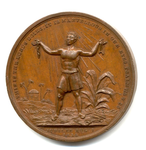Slavery Abolition Act coin. Close-up of a coin commemorating the United Kingdom's Slavery Aboliton