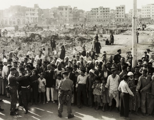Hungry crowds during the Suez Crisis. British troops control crowds of hungry civilians in the days