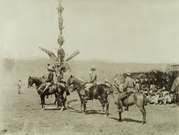 General Wolseley inspects troops. General Wolseley and other senior British Army officers sit
