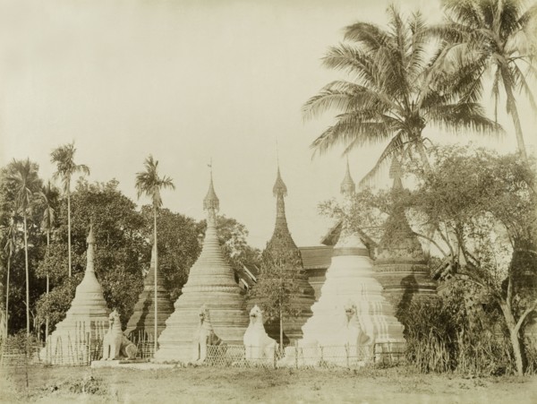 Stone 'zeidis' at Wuntho. Several carved stone 'zeidis' or pagodas are guarded by stone 'chinthes'