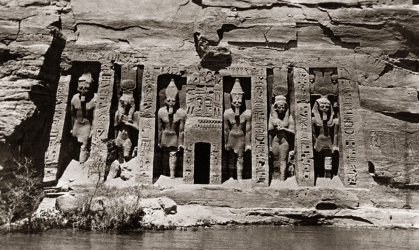 Carvings at the Abu Simbel rock temples. Ancient Egyptian hieroglyphs and figures are carved into a