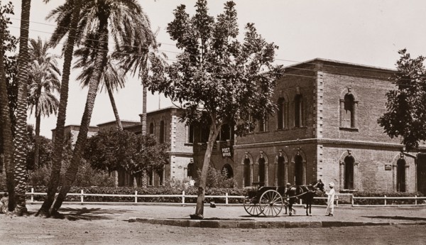 Post Office in Khartoum. Exterior view of the Post Office in Khartoum. A Sudanese man with a horse