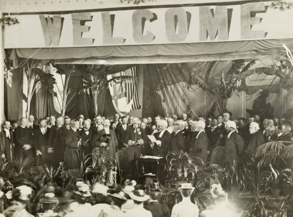 Sir Arthur Lawley is sworn in as Governor. Sir Arthur Lawley (centre) holds a bible in both hands