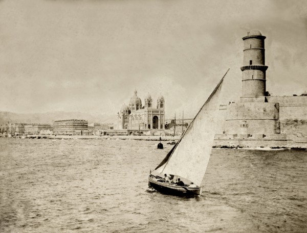 Vieux Port, Marseille. A small boat sails near to the entrance of Vieux Port at Marseille. The