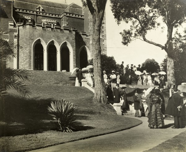 New Year's garden party at Government House, Perth. Formally dressed guests socialise in the