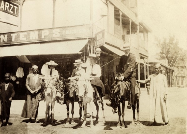 The Lawley children ride donkeys at Port Said. The Lawley children, left to right: Cecilia, 'Ned'