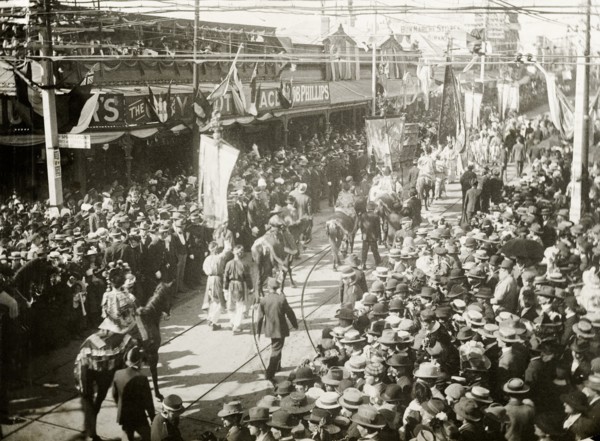 Royal parade through China Town, Perth. Crowds of spectators line the streets in Perth's China Town
