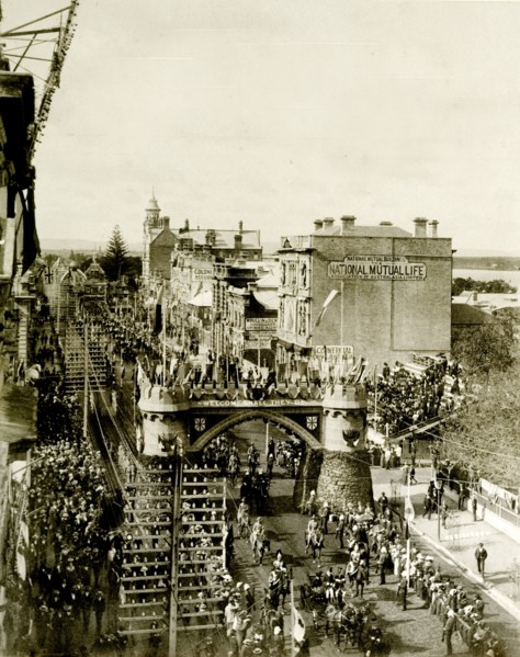 Royal procession beneath the Coach Arch. A procession for the Duke and Duchess of Cornwall and York