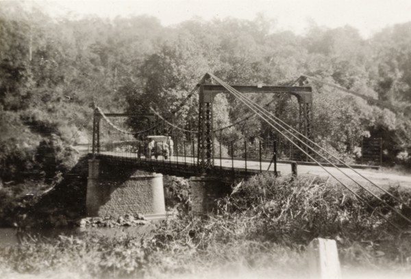 Tahsai Bridge in Shan State. View of a motorcar parked on Tahsai suspension bridge over the Salween