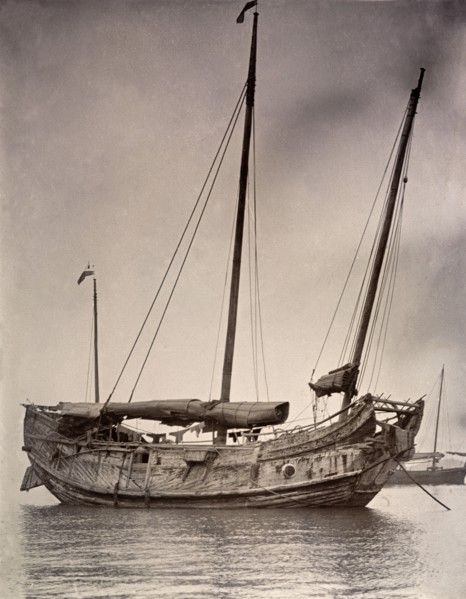 A Chinese junk at anchor. A Chinese junk, pictured at anchor with its sails rolled down. Hong Kong,