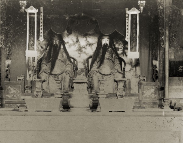 Statues of deities inside a Chinese Joss house. The statues of two Chinese deities ('Joss'),