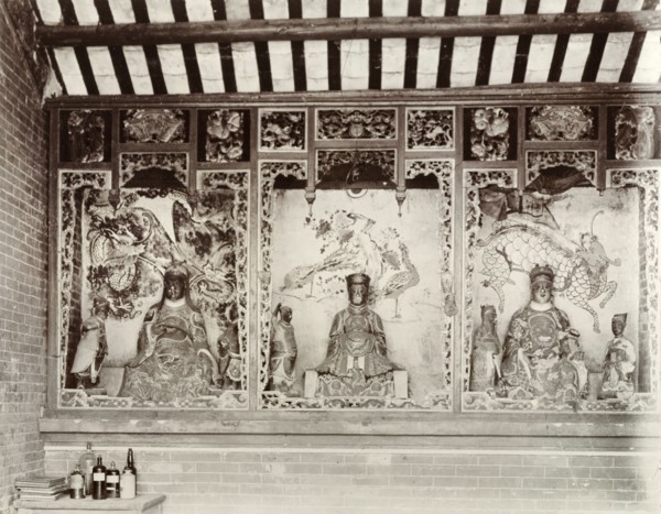 Deities inside a Chinese Joss house. Statues of Chinese deities ('Joss') line the walls inside a