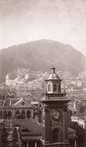A clock tower in Hong Kong. View over Hong Kong looking south, featuring a prominent clock tower,