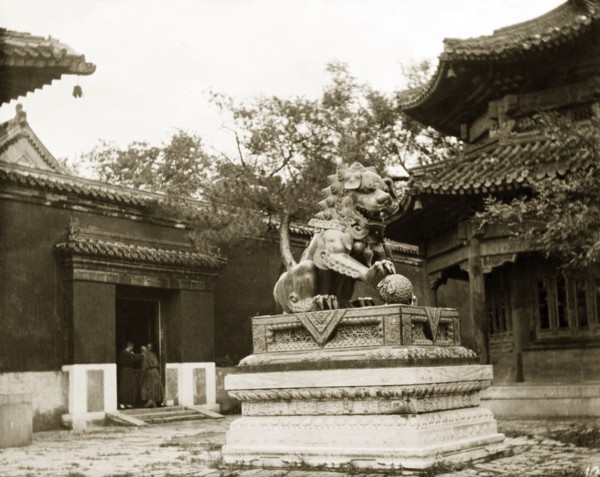 Statue of a lion at a Buddhist temple in China. An ornamental statue of a lion stands in the